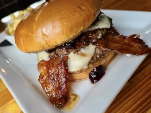 The PB&J burger, a menu staple at Kentucky restaurant The Manhattan Project, contains peanut butter, jelly, bacon and habanero jack cheese. (Photo: The Manhattan Project)