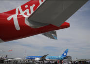 A Boeing 787-9 Dreamliner of Air Tahiti Nui rolls out for a demonstration flight at Paris Air Show, in Le Bourget, east of Paris, France, Tuesday, June 18, 2019. The world's aviation elite are gathering at the Paris Air Show with safety concerns on many minds after two crashes of the popular Boeing 737 Max. (AP Photo/Michel Euler)