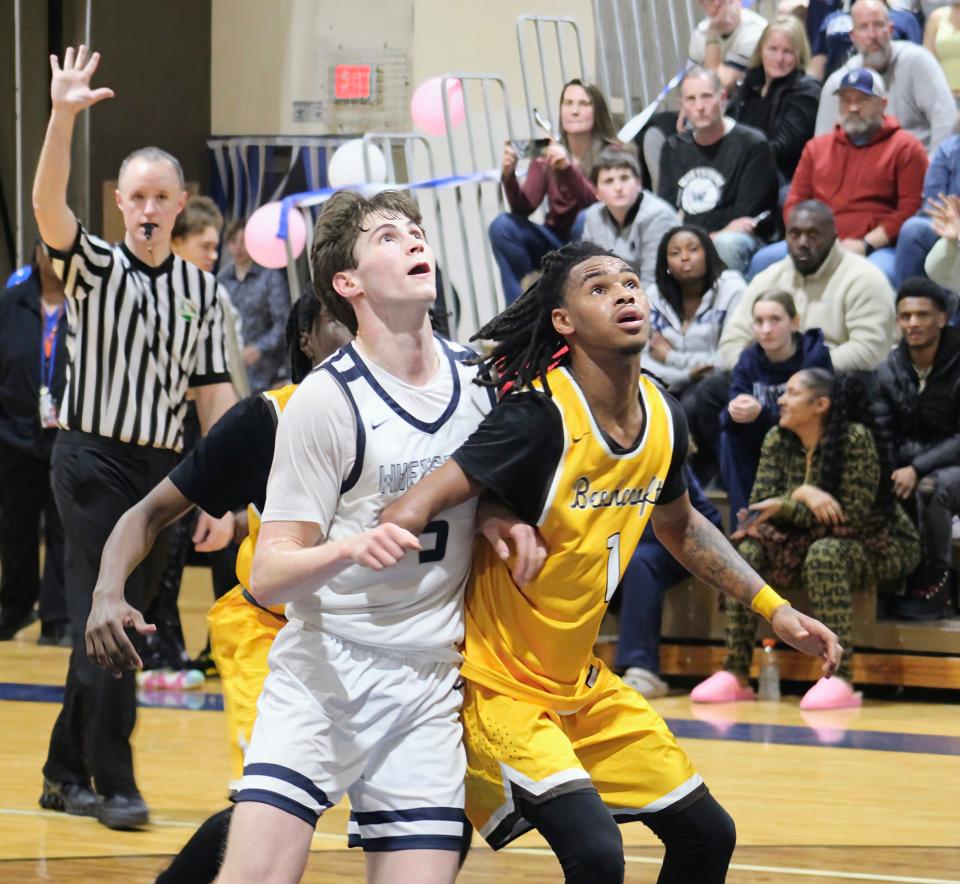 Whetstone’s Noah Knostman is boxed out by Beechcroft’s Rosean Burns during the Braves’ 58-56 home win on Friday.