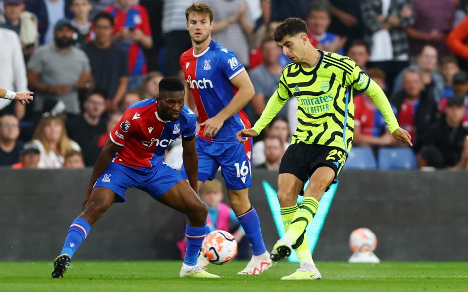 Arsenal's Kai Havertz in action with Crystal Palace's Jefferson Lerma and Joachim Andersen