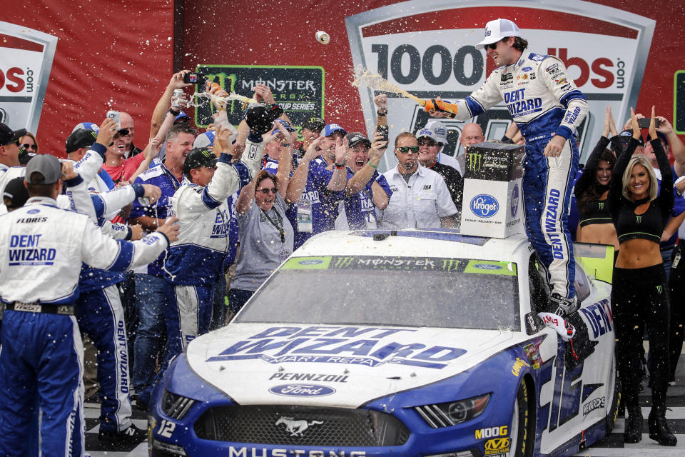 Ryan Blaney celebrates in Victory Lane after winning a NASCAR Cup Series auto race at Talladega Superspeedway, Monday, Oct 14, 2019, in Talladega, Ala. (AP Photo/Butch Dill)