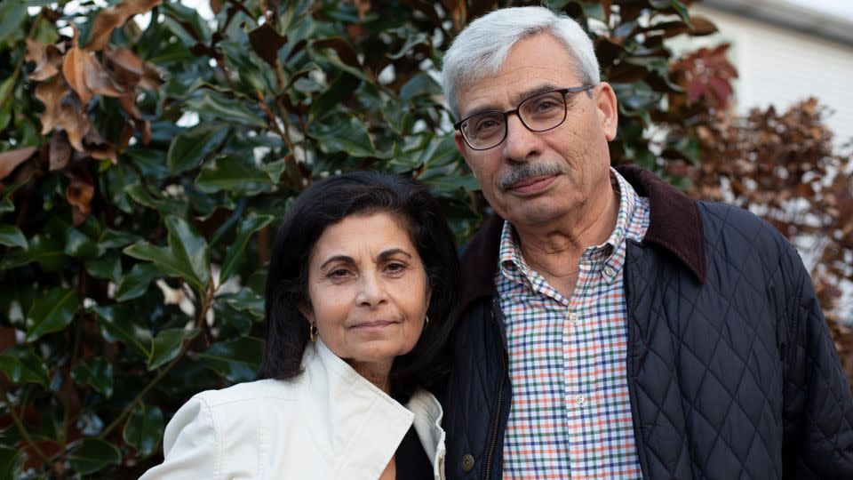 Rima Qasim and Adnan Khalil pose for a portrait last week in their backyard in Clifton. - Laura Oliverio/CNN