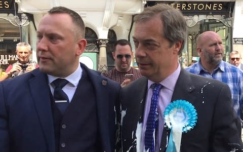 Mr Farage's was covered in the milkshake - Credit: PA