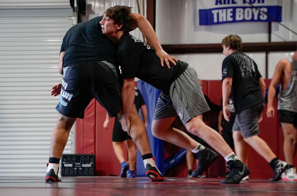 Christian Moder runs through a drill with a partner during First Baptist Academy's practice at Coach Mike DiGrigoli's house in Naples on Tuesday, Feb. 14, 2023.