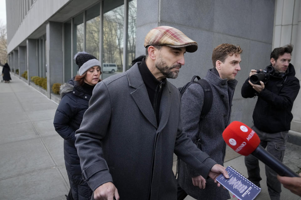 Cesar De Castro, attorney for Genaro Garcia Luna, Mexico's former top security official, arrives to Federal court in Brooklyn, Tuesday, Jan. 17, 2023, in New York. Luna goes on trial on charges of helping the Sinaloa Cartel traffic drugs and protect them from capture while he was serving as Mexico’s top security official. (AP Photo/John Minchillo)