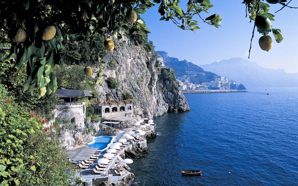 Lemon trees frame a view of Santa Caterina Hotel on the Amalfi Coast