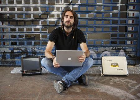 Cybersecurity researcher Ruben Santamarta poses for a photo near Madrid, July 30, 2014. REUTERS/Andrea Comas