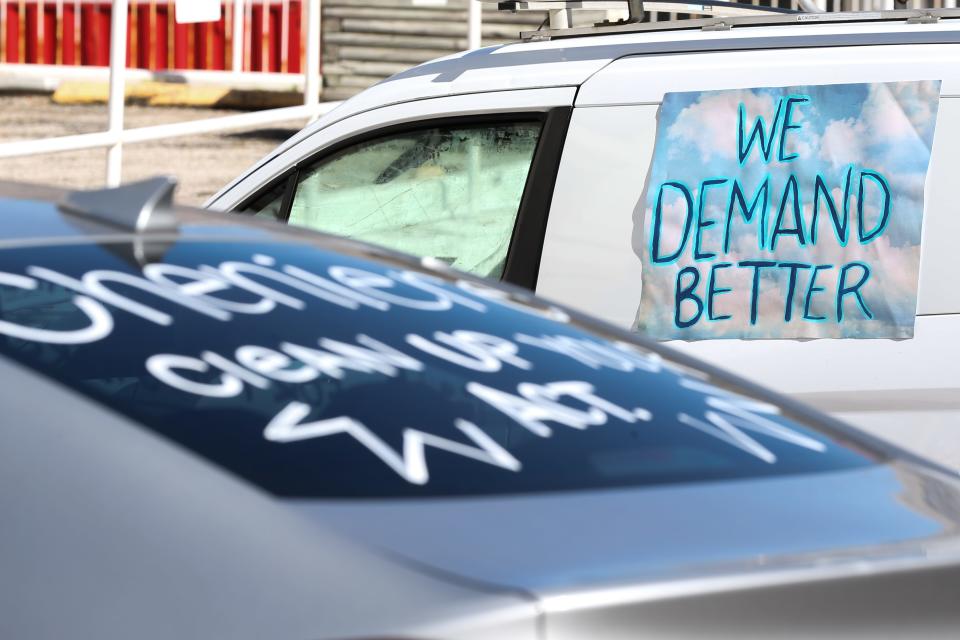 Vehicles with signage against Cheniere Energy were parked ahead of a caravan in downtown Corpus Christi Saturday, Feb. 3, 2024.