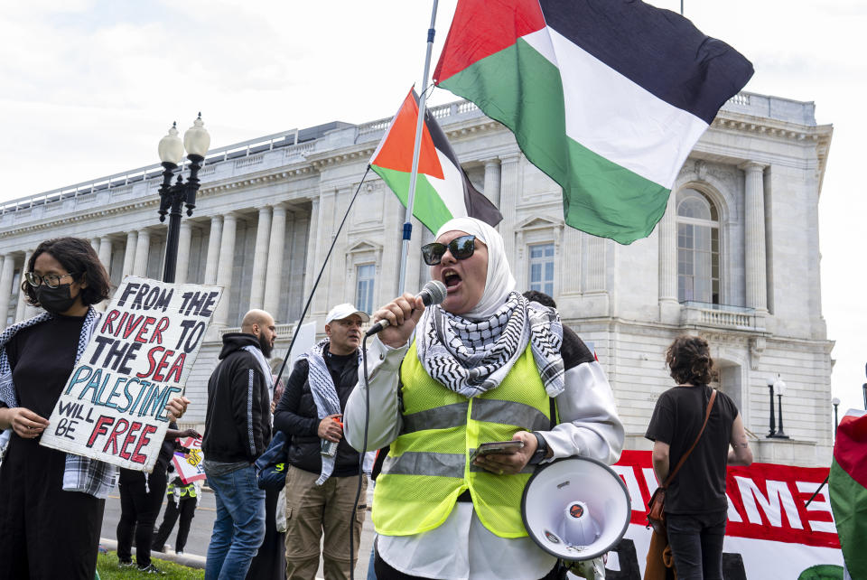 Pro-Palestinian activists demonstrate outside the Capitol in Washington, Saturday, April 20, 2024, as the House prepares to vote on approval of $95 billion in foreign aid for Ukraine, Israel and other U.S. allies. (AP Photo/J. Scott Applewhite)