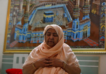 Zakia Jafri, whose late husband, a lawmaker for the Congress party which now sits in opposition, and was hacked to death by a Hindu mob in riots, offers prayers inside her son's house in Surat, India, September 15, 2015. REUTERS/Amit Dave