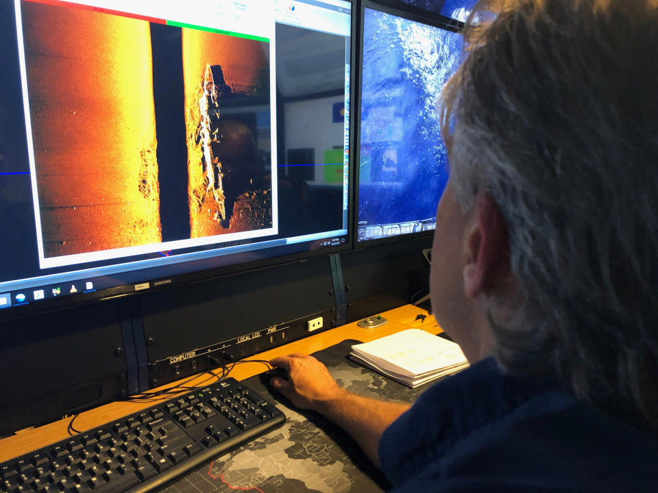 Rob Kraft, director of undersea operations at Vulcan Inc., reviews sonar scans of a warship from the World War II Battle of Midway that was found by the crew of the research vessel Petrel on Sunday, Oct. 20, 2019 off Midway Atoll in the Northwestern Hawaiian Islands. The crew confirmed the ship was the flagship Japanese aircraft carrier Akagi. (AP Photo/Caleb Jones)