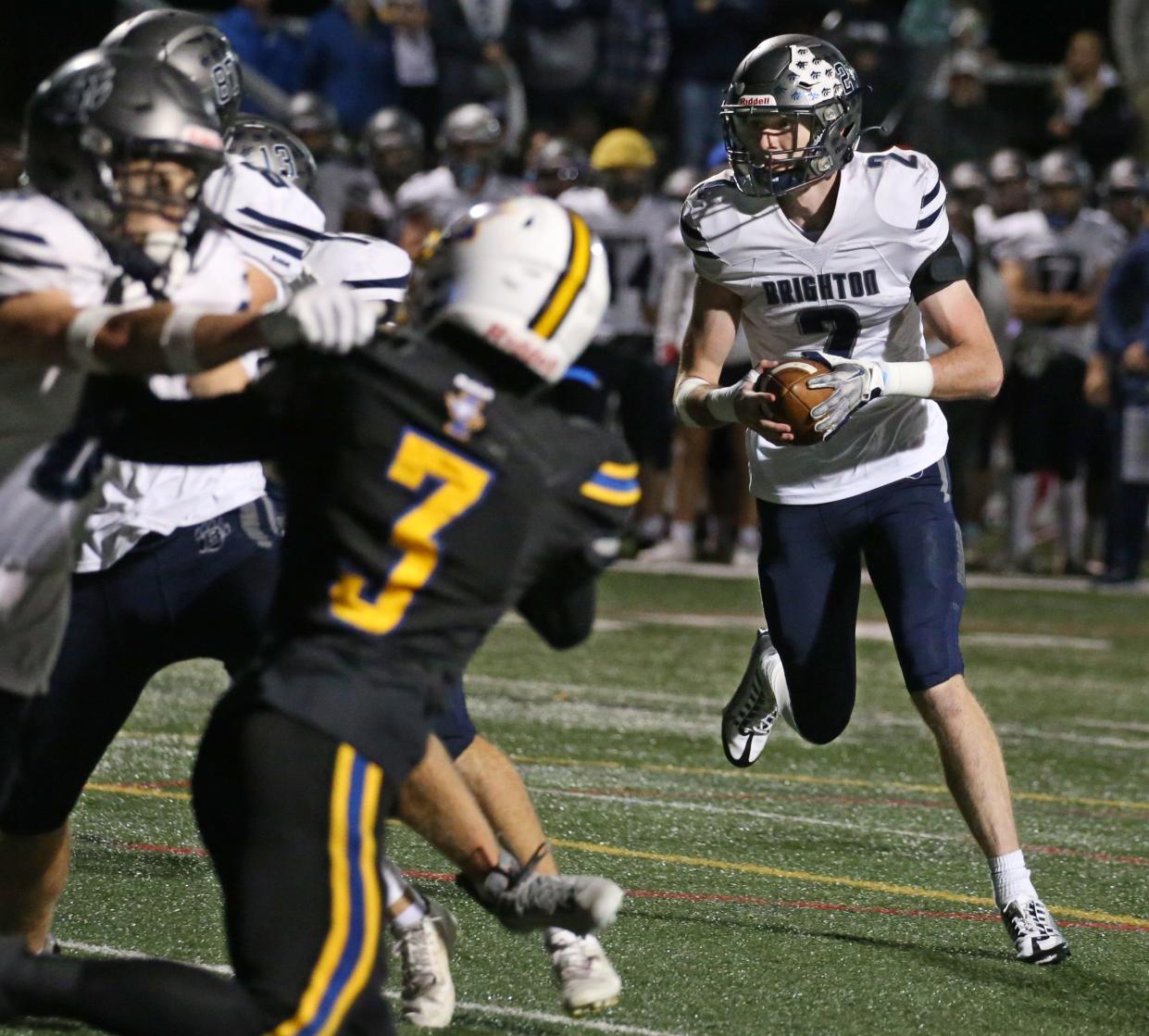 Brighton quarterback Tyler Martinovich waits for his blocks before rushing into the end zone to score in the first quarter against Irondequoit.