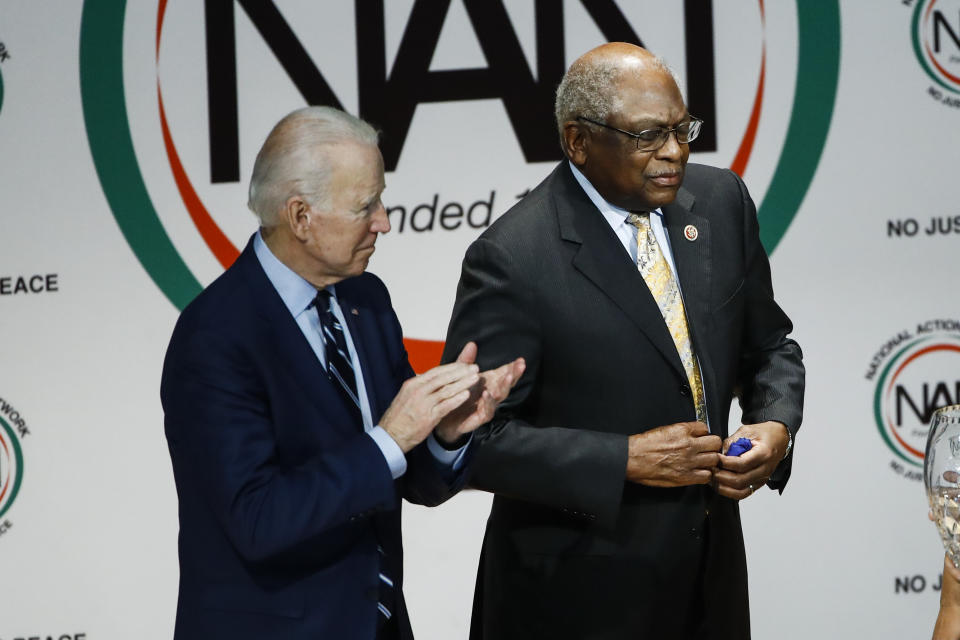 Democratic presidential candidate former Vice President Joe Biden, applauds Rep. James Clyburn, D-S.C., at the National Action Network South Carolina Ministers' Breakfast, Wednesday, Feb. 26, 2020, in North Charleston, S.C. (AP Photo/Matt Rourke)