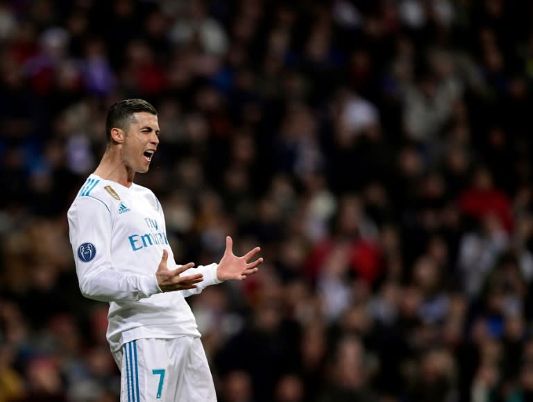 Real Madrid's Cristiano Ronaldo reacts to missing a goal during their match against Borussia Dortmund at the Santiago Bernabeu stadium in Madrid on December 6, 2017