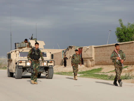 Afghan national Army (ANA) troops arrive near the site of an ongoing attack on an army headquarters in Mazar-i-Sharif northern Afghanistan April 21, 2017. REUTERS/Anil Usyan