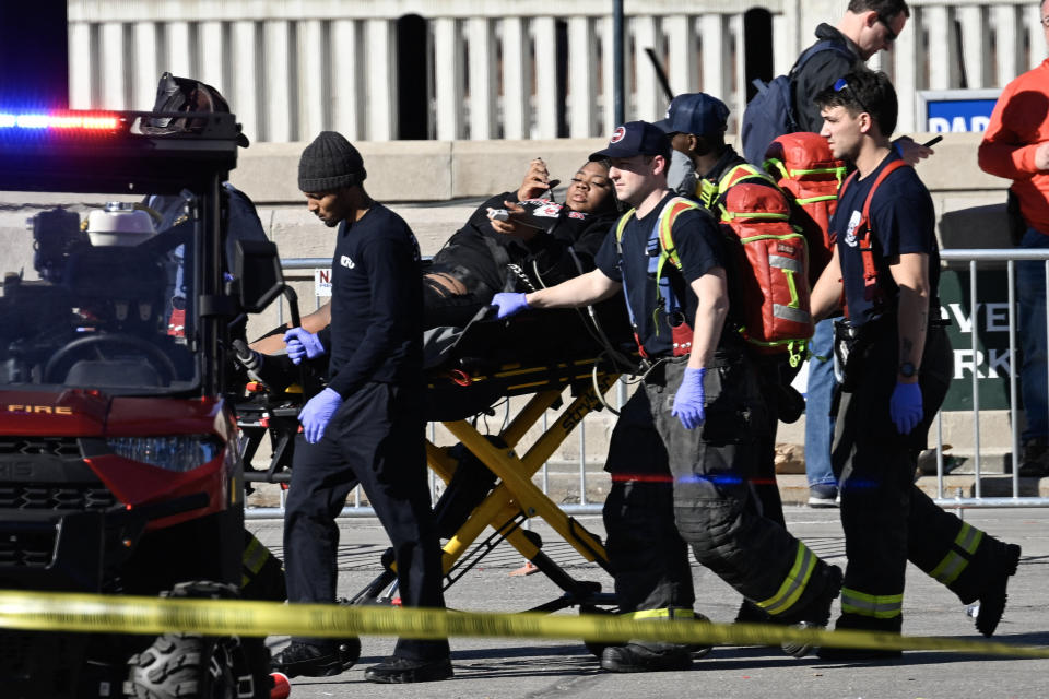 First responders tend to an injured person as they bring her out of Union Station near the Kansas City Chiefs' Super Bowl LVIII victory parade on Wednesday.