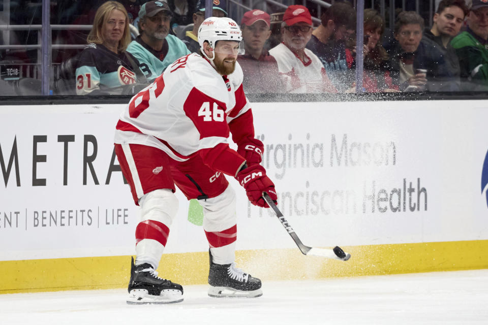 Detroit Red Wings defenseman Jeff Petry (46) passes the puck against the Seattle Kraken during the second period of an NHL hockey game, Monday, Feb. 19, 2024, in Seattle. (AP Photo/John Froschauer)