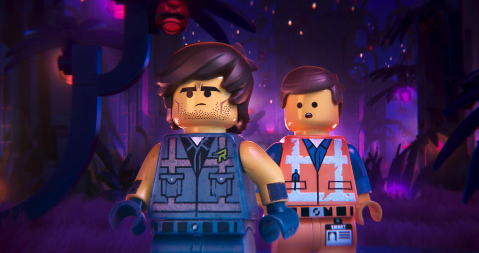 This image released by Warner Bros. Pictures shows the characters Rex Dangervest, left, and Emmet, both voiced by Chris Pratt, in a scene from "The Lego Movie 2: The Second Part." (Warner Bros. Pictures via AP)