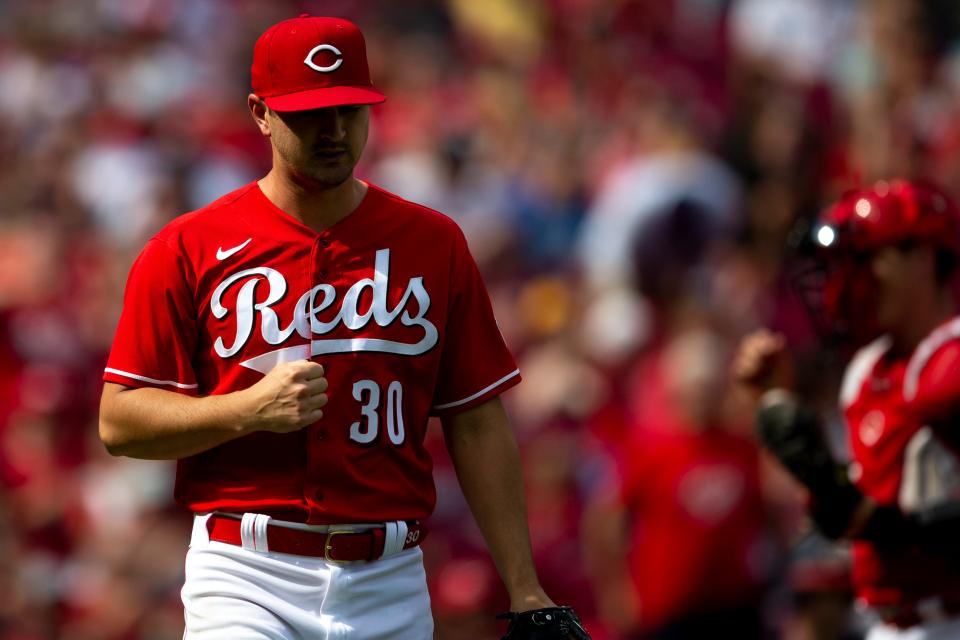 Cincinnati Reds starting pitcher Tyler Mahle (30) celebrates after an out at the plate to end the top of the third inning of the MLB game between the Cincinnati Reds and the Washington Nationals at Great American Ball Park in Cincinnati, Saturday, June 4, 2022.