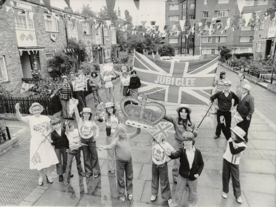 Residents in St Matthews Road, Brixton after they won a competition for the best decorated street to celebrate the Silver Jubilee of Queen Elizabeth II (Getty Images)