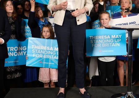 Britain's Prime Minister Theresa May's shoes can be seen as she speaks at an election campaign event at Thornhill Cricket and Bowling Club in Dewsbury, West Yorkshire, Britain, June 03, 2017. REUTERS/Hannah McKay