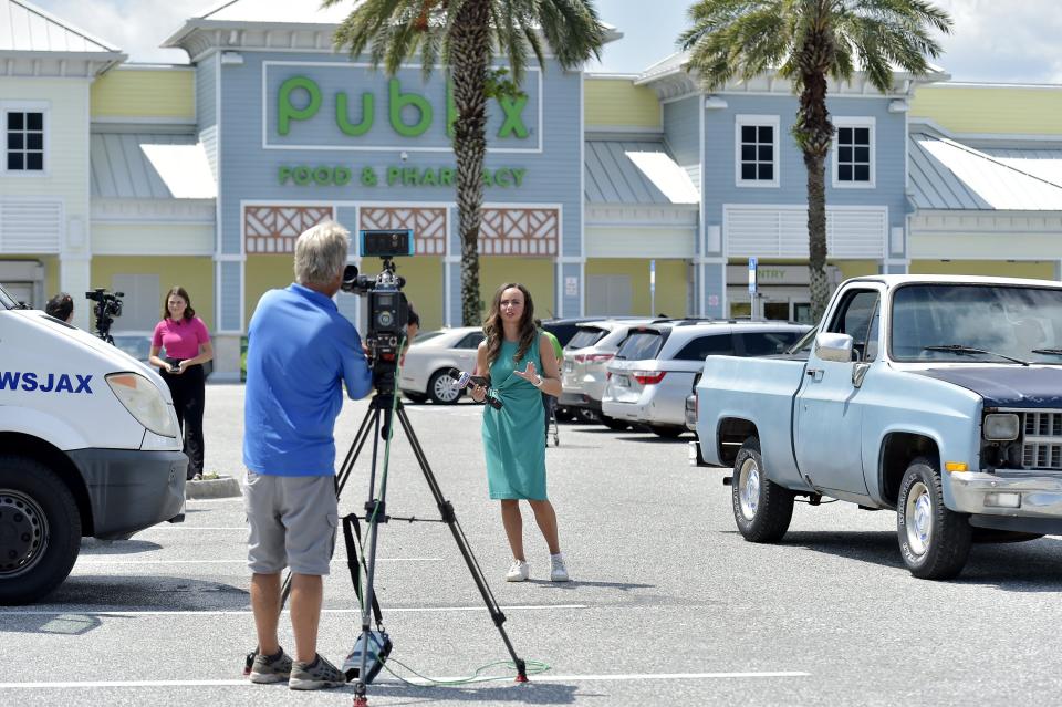 Action News Jax reporter Alexus Cleavenger and other news stations do their reporting from the parking lot at the Neptune Beach Publix at 630 Atlantic Blvd. on Wednesday after a ticket with the winning numbers in the record-breaking Mega Millions lottery jackpot was traced to being sold there. The Florida Lottery said it was the single winning ticket for the $1.6 billion jackpot.