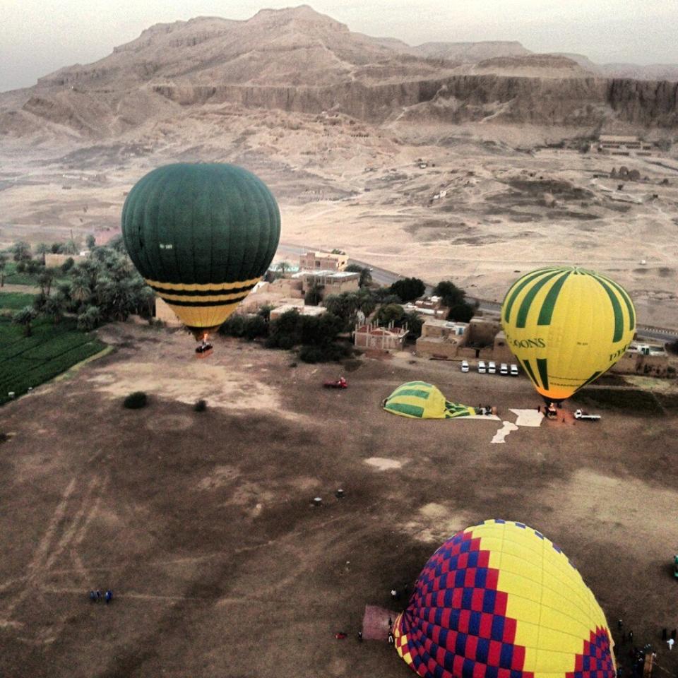 In this image made available by Christopher Michel, the launch site near Luxor in Egypt, shortly prior to a hot air balloon explosion which killed at least 18 tourists including a number of tourists Tuesday Feb. 26, 2013. Witnesses described hearing a loud explosion before seeing plumes of smoke as the balloon caught fire and plunged into a sugar cane field west of Luxor, which is 320 miles (510km) south of the capital Cairo. The casualties are believed to include British and French tourists, as well as other nationalities, a security official in the country said. (AP Photo/Christopher Michel)