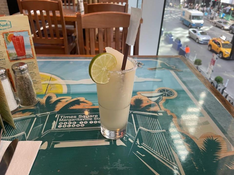 Margarita with lime wedge and straw at Margaritaville