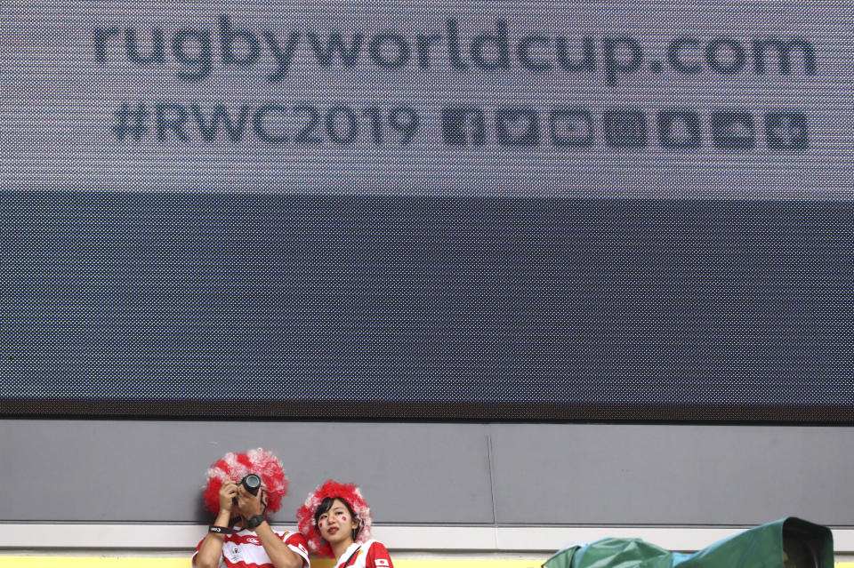 Fans wait for the start of the Rugby World Cup Pool A game at Shizuoka Stadium Ecopa between Japan and Ireland in Shizuoka, Japan, Saturday, Sept. 28, 2019. (AP Photo/Eugene Hoshiko)