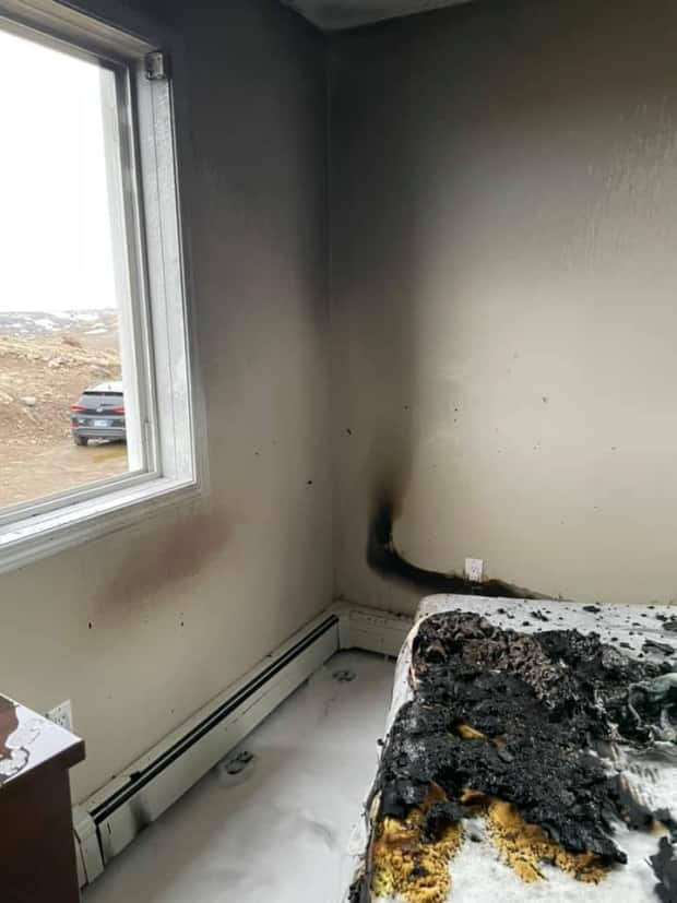 A damaged phone charger is believed to be the reason behind an apartment fire in Iqaluit. (Submitted by Layla Autut - image credit)