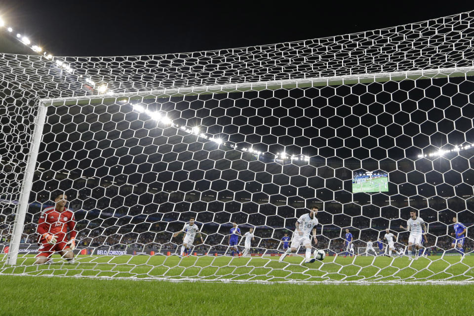 Argentina's Lionel Messi takes the ball after scoring from a penalty spot against Paraguay during a Copa America Group B soccer match at the Mineirao stadium in Belo Horizonte, Brazil, Wednesday, June 19, 2019. (AP Photo/Natacha Pisarenko)