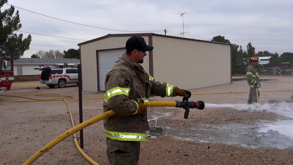 Eddy County Fire Services Director Joshua Mack fights a fire south of Carlsbad in November 2019.