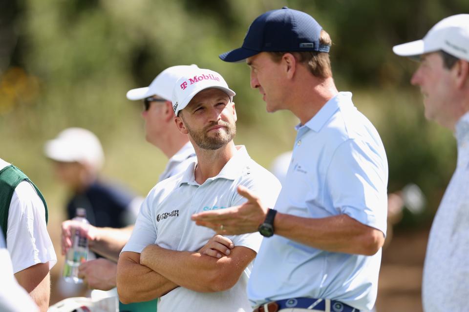 Wyndham Clark of the United States talks with former professional NFL player, Peyton Manning on the seventh hole during the Pro-Am to the BMW Championship at Castle Pines Golf Club on August 21, 2024 in Castle Rock, Colorado. (Photo by Christian Petersen/Getty Images)