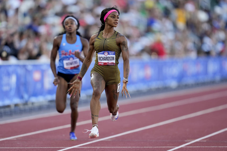 Sha'Carri Richardson wins a heat women's 100-meter run during the U.S. Track and Field Olympic Team Trials Friday, June 21, 2024, in Eugene, Ore. (AP Photo/Charlie Neibergall)