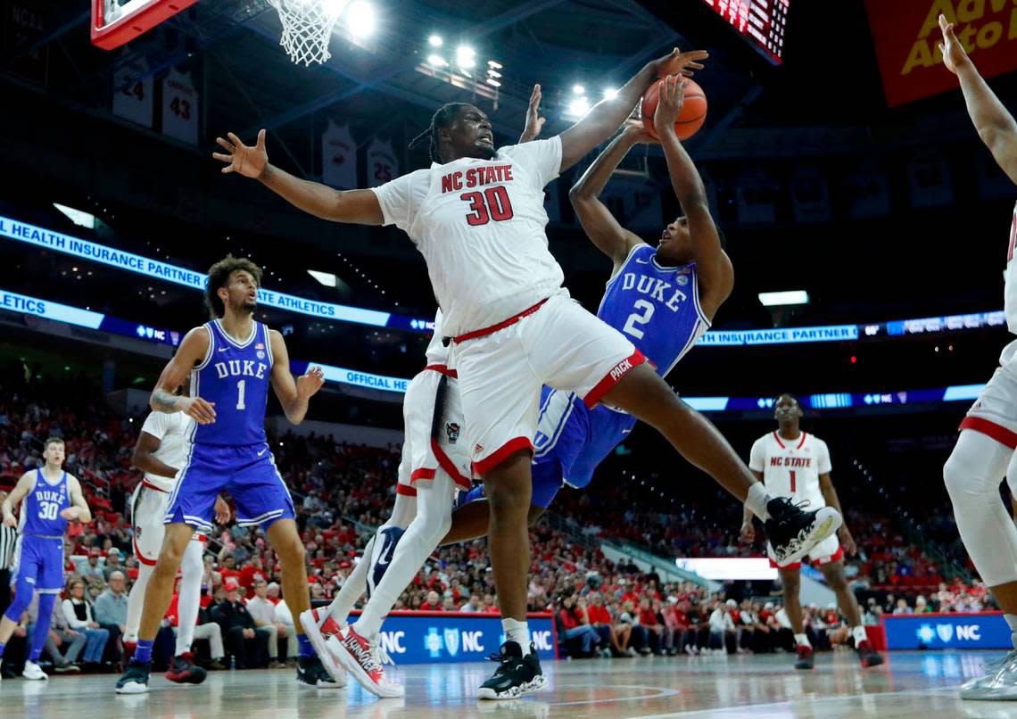 N.C. State’s D.J. Burns Jr. (30) blocks the shot by Duke’s Jaylen Blakes (2) during N.C. State’s 84-60 victory over Duke at PNC Arena in Raleigh, N.C., Wednesday, Jan. 4, 2023.