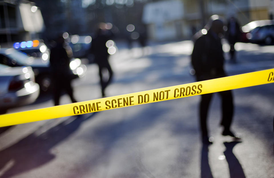 <p>Crime scene tape blocks of the area of an apartment complex where authorities say two police officers were shot, leading to a neighborhood search for the suspected gunman, Dec. 12, 2014, in Decatur, Ga. (AP Photo/David Goldman) </p>