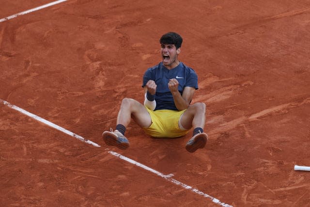 Carlos Alcaraz celebrates winning his first French Open title at Roland Garros