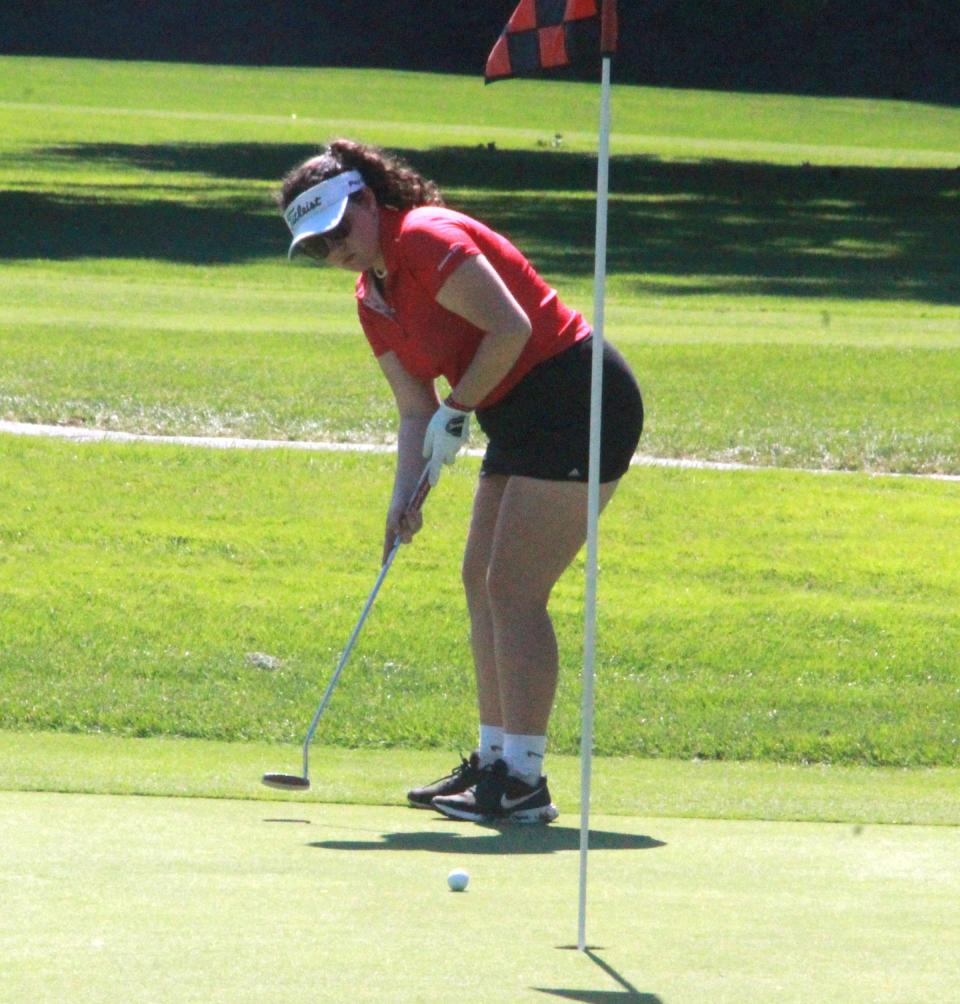 Coldwater's Violet Cunkle looks to sink a putt on the 18th hole Wednesday in the Cardinals' season opener versus Marshall
