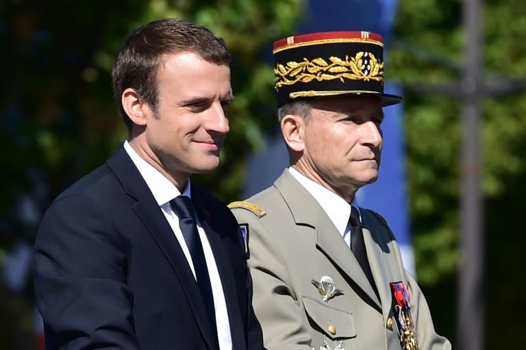 French President Emmanuel Macron (left) and outgoing armed forces chief General Pierre de Villiers, pictured during the annual Bastille Day military parade in Paris on July 14, 2017