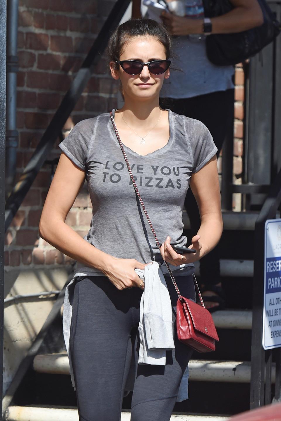 Nina Dobrev wears a hilarious shirt on Tuesday for a trip to the gym in West Hollywood.