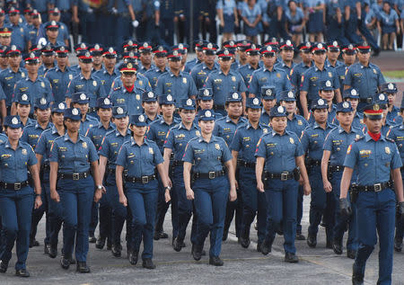 Female policewomen from the Philippine National Police (PNP) march during the National Police chief handover ceremony in Camp Crame, Quezon City, metro Manila, Philippines, April 19, 2018. REUTERS/Dondi Tawatao