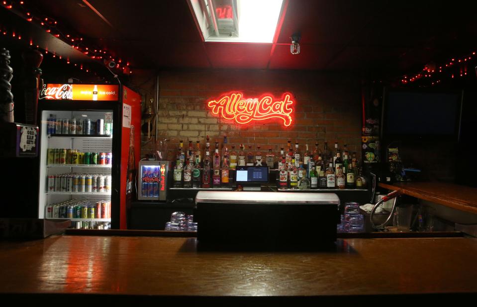 The new logo for Alleycat is pictured behind the downstairs bar Tuesday, April 23, 2024 in downtown Iowa City, Iowa.