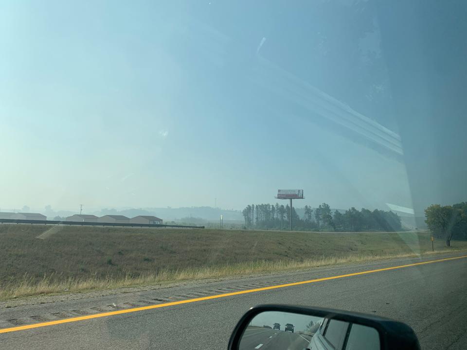Smoke pictured from southbound Interstate 75 continues to billow Sunday throughout the Grayling area.