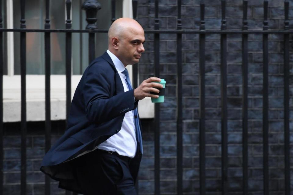 Communities Secretary Sajid Javid holds a reusable coffee cup as he leaves 10 Downing Street (PA Wire/PA Images)