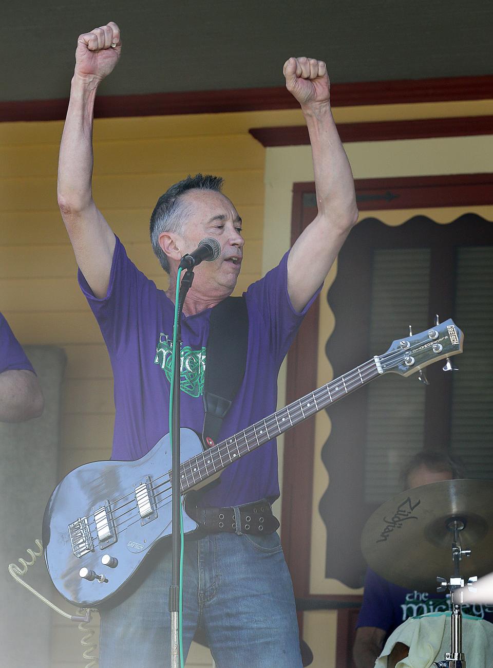 Mick Hurray of The Mickys entertains the crowd during Highland Square's annual Porch Rokr Festival on Saturday in Akron.