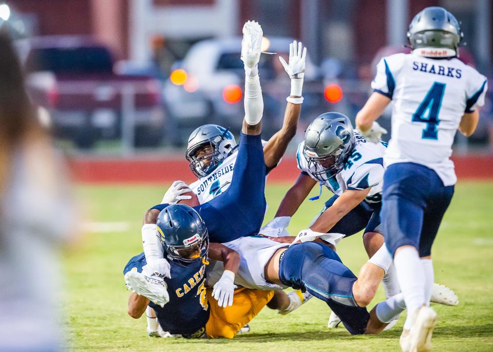 Sharks Caleb Alexander runs the ball as the Southside Sharks take on the Carencro bears.  Friday, Sept. 16, 2022.