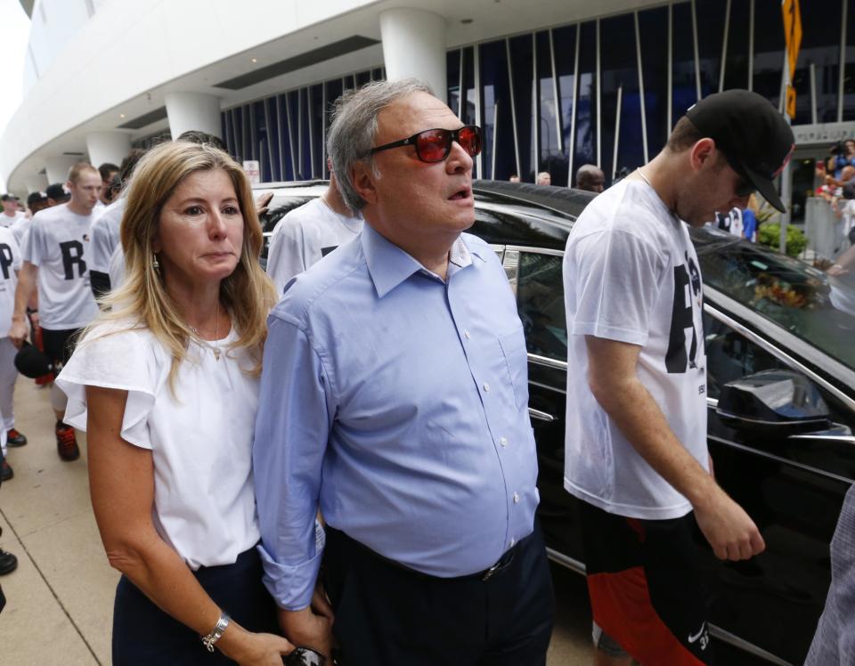 <p>Miami Marlins owner and CEO Jeffrey Loria and his wife Julie walk with players and staff as they escort a hearse carrying the body of Marlins pitcher Jose Fernandez as it leaves Marlins Park stadium, Wednesday, Sept. 28, 2016, in Miami. Fernandez was killed in a weekend boat crash along with two friends. (AP Photo/Wilfredo Lee) </p>