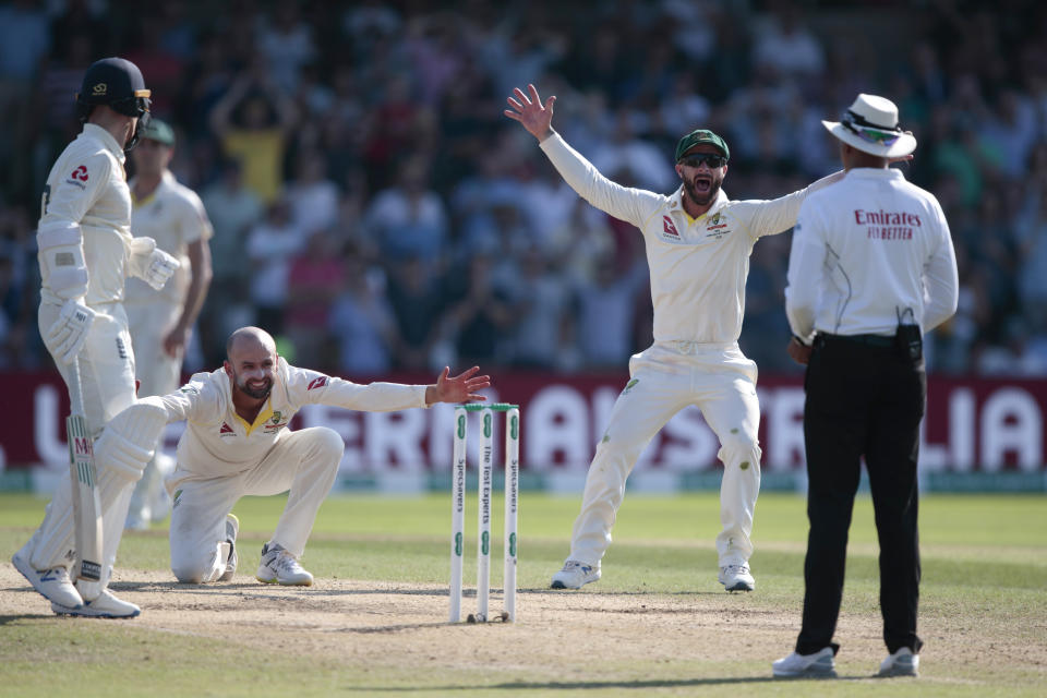 Australia's Nathan Lyon, bottom left, appeals after England's Ben Stokes is hit on the pad which Australia were not able to review having used up their review quota on the fourth day of the 3rd Ashes Test cricket match between England and Australia at Headingley cricket ground in Leeds, England, Sunday, Aug. 25, 2019. (AP Photo/Jon Super)