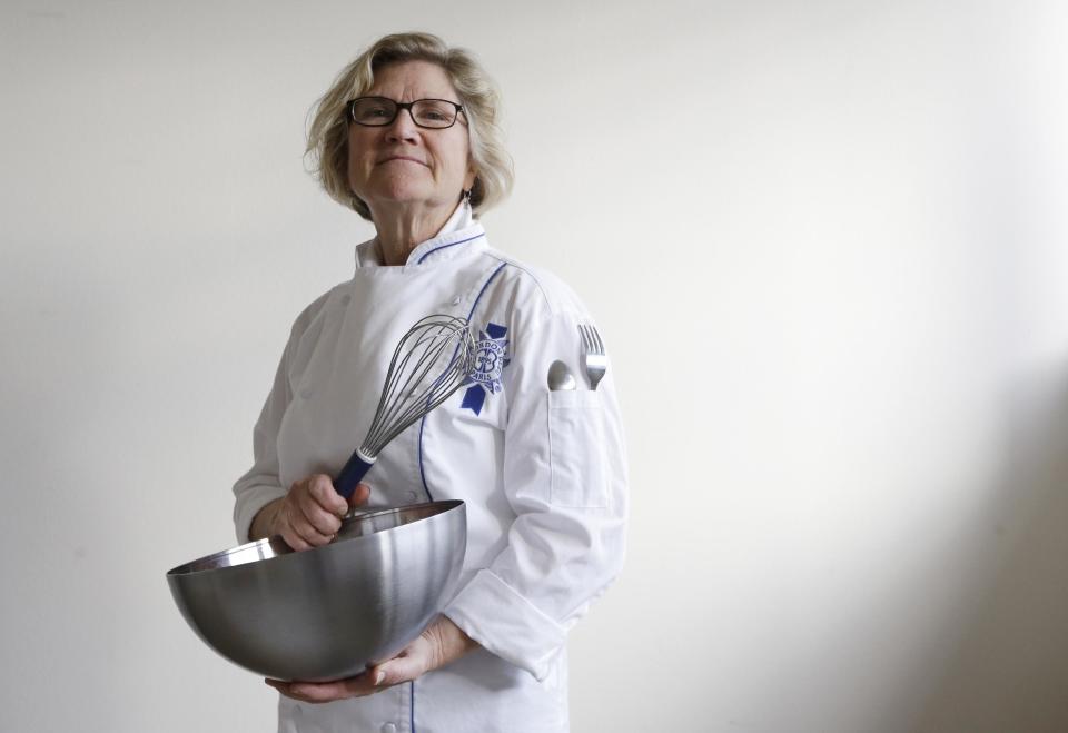 Marla Molly Poiset, a Le Cordon Bleu-trained French pastry chef, stands in her home in Seattle in this photo made Tuesday, Nov. 12, 2013. Poiset had swapped her three-decade-old home-furnishing store and interior design business in Colorado for a life of world travel when she learned some devastating news: Her eldest daughter had leukemia. She suspended her travels to help her daughter and her family through the ordeal. She then continued her tour, attending cooking school in Paris. Poiset, 59, graduated last spring, and had an idea: “Blending my newfound patisserie skills with medical cannabis for people like my daughter,” she says. So she abandoned Paris for Seattle, where she’s been developing recipes for marijuana-infused chocolate truffles for recreational and medical use. Her aim is to create “a beautiful package” like French chocolate or pastries for people like her daughter. They could “ingest discreetly and enjoy life, rather than everything being in a pill,” she says. (AP Photo/Elaine Thompson)