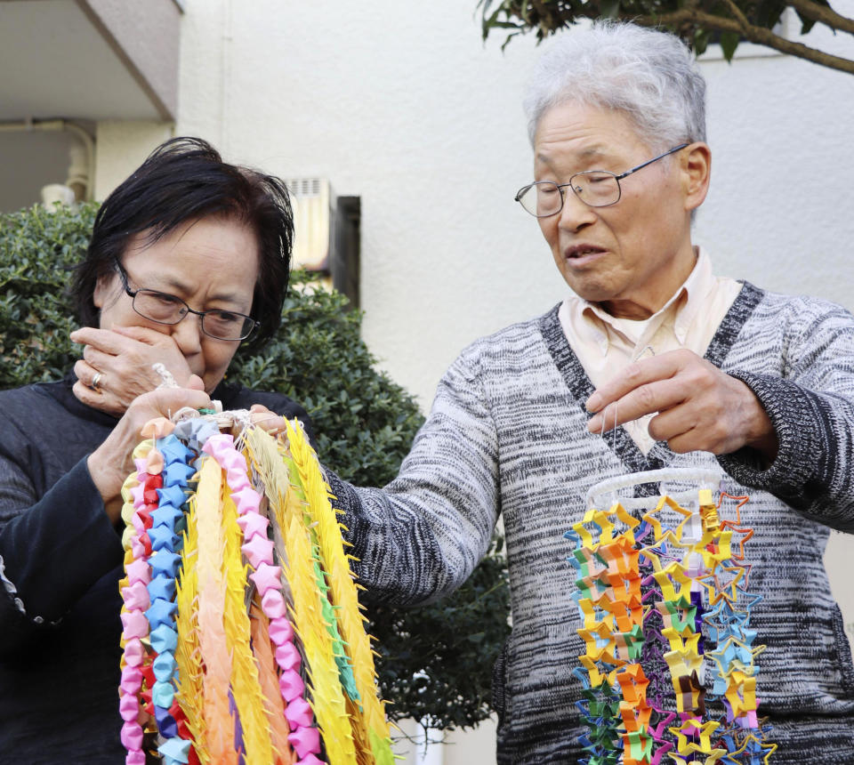 Mother Sachiko Yasuda cries while speaking to the media with father Hideaki Yasuda of Japanese freelance journalist Jumpei Yasuda outside their home in Iruma, northwest of Tokyo, Wednesday, Oct. 24, 2018. A man believed to be journalist Yasuda who disappeared three years ago in Syria has been released and is now in Turkey, a Japanese official said. (Kyodo News via AP)